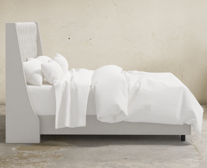 Londyn Tufted Customizable Wingback Bed